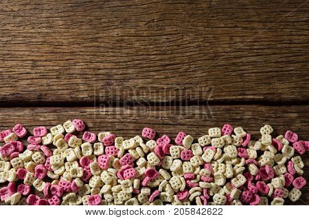 Overhead of honeycomb cereals on wooden table