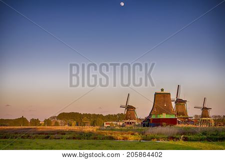 Travel Ideas and Concepts.Line of Traditional Dutch Windmills in the Village of Zaanse Schans in the Netherlands. Horizontal Image Composition