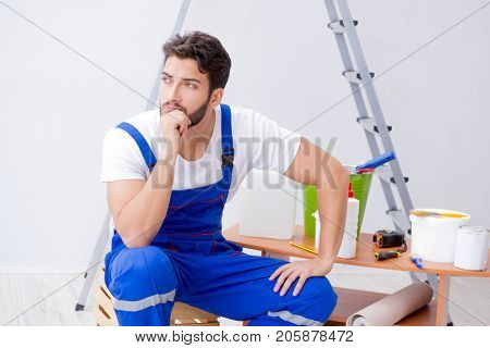 Repairman doing renovation repair in the house with paper wallpa