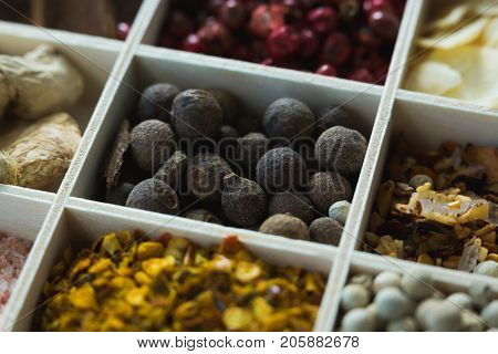 Close-up of various spices arranged in tray