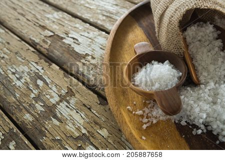 Close-up of sea slat on wooden plate