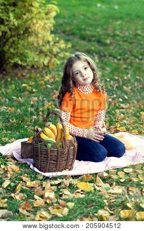 beauty girl with fruit in summre park.
