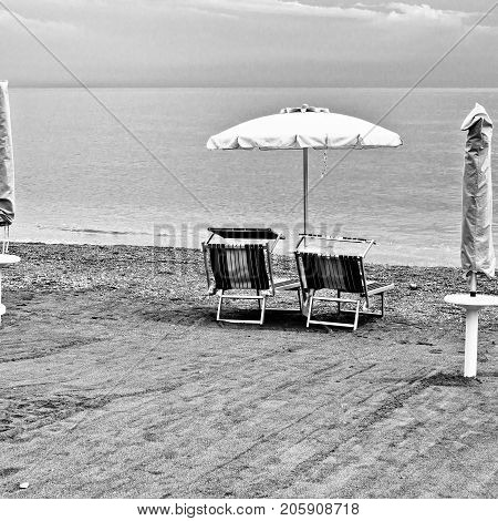 Beach Umbrella and Sun Bed in the Sandy Coast near the Italian City of Minori Retro Image Filtered Style