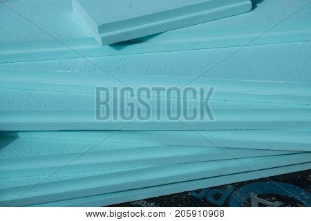 XPS polystyrene insulation boards closeup stacked on the floor
