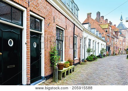 Typical Dutch brick houses in Holland. Street View with bikes parked in the historical center of Amersfoort in the Netherlands