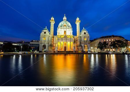Night View Of Famous Saint Charles's Church At Karlsplatz In Vienna, Austria
