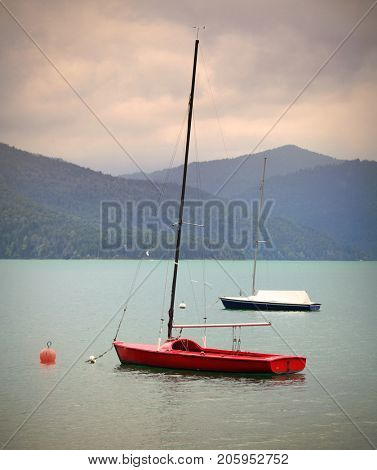 Sailboats on mountain lake. Walchensee or Lake Walchen is one of the deepest and largest alpine lakes in Germany, with a maximum depth of 192.3 metres and an area of 16.4 square kilometres.