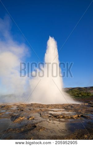 Eruption of the Geysir geyser. Valley Haukadalur, Iceland. Golden Ring Tourist Attraction