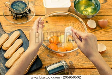 Image of savoyardi cookies on cutting board, cups, coffee, cream cheese, yolks, squirrels