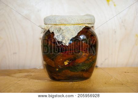 Assortie Jars Of Marinated Vegetables Picles Tomato On Wooden Background