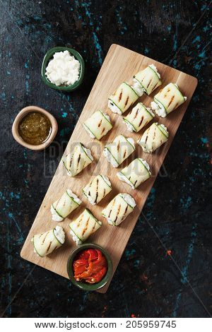 Grilled zucchini rolls filled with fresh cottage cheese