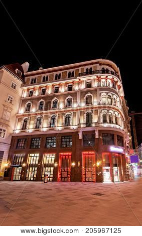 Low angle view of historic illuminated building at night at Vienna, Austria