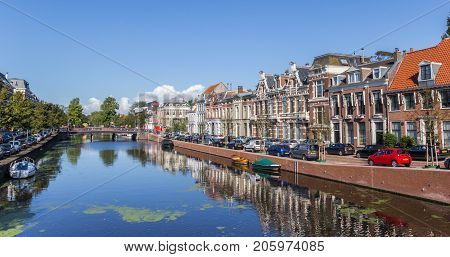 HAARLEM, NETHERLANDS - SEPTEMBER 03, 2017: Panorama of historic houses at the Nieuwe Gracht canal in Haarlem Netherlands