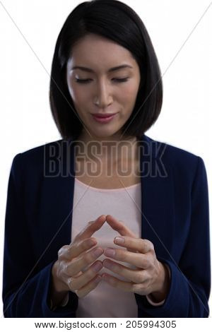 Businesswoman pretending to hold invisible object against white background