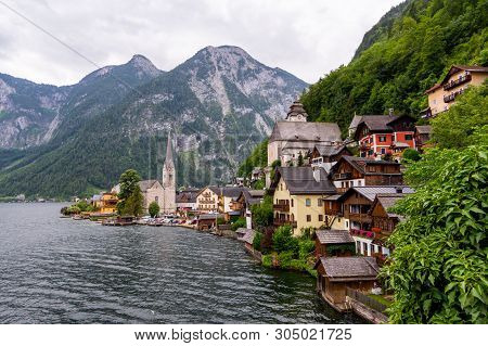 Picturesque View Of Hallstatt Village, Situated On The Bank Of Hallstatter Lake, High Alps Mountains
