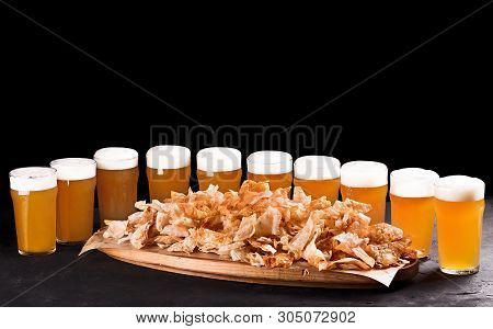 Beer Set For A Large Group Of Friends. Beer In Glasses Closeup On The Concrete Table. Beer And Snack
