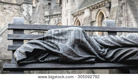Dublin, Ireland - February 11, 2019: Bronze Sculpture Of Sculptor Timothy Schmalz Depicting A Facele