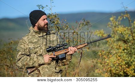Hunting Equipment For Professionals. Hunting Is Brutal Masculine Hobby. Man Aiming Target Nature Bac