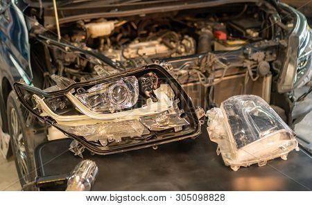 Car Mechanic, Doing Cleaning, The Headlight Of The Car, Installation And Turning Headlight Of Modern