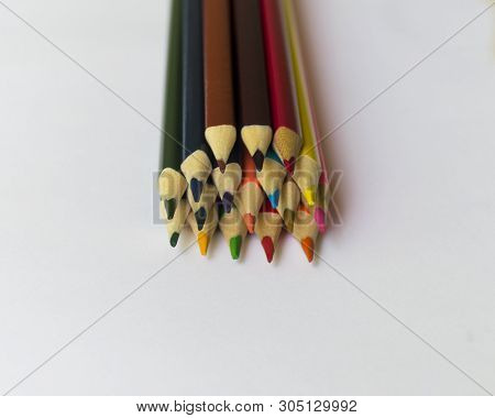 ..multicolored Pencils Lie On A White Table.