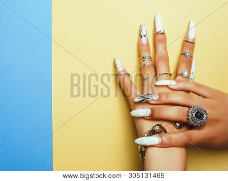 Woman Hands Holding Colorful Paper Copyspace Wearing A Lot Of Jewelry And Long Nails