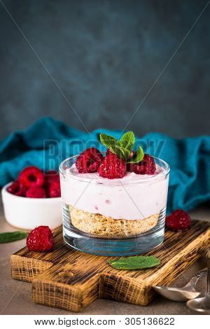 No Baked Cheesecake With Raspberry In Glass Jar. Healthy Dessert.