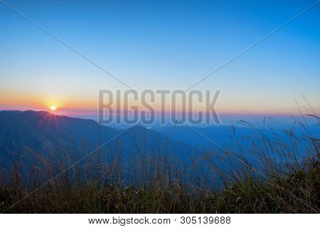 Mountain Silhoette At Sunrise Glowing Sky, Khao Khieo Sun Nork Wua Mountain, Kanchanaburi Thailand