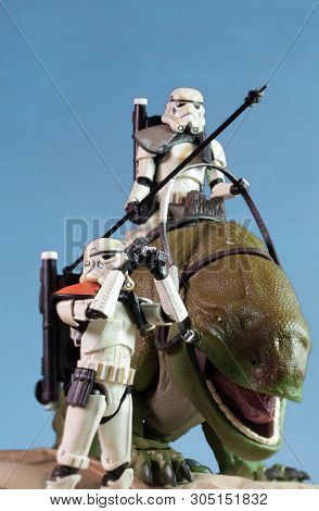JUNE 1 2018: Recreation of a scene from Star Wars showing Sandtroopers and Dewback in the deserts of Tatooine, searching for the droids with the stolen Deathstar plans - Hasbro action figures