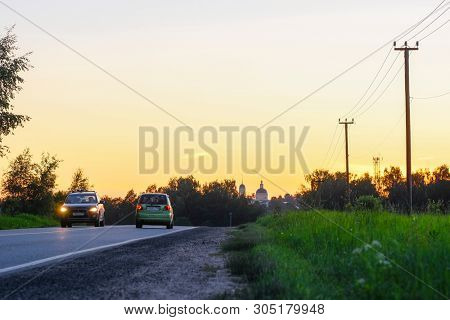 Moscow region, Russia - June, 2, 2019: image of Landscape with the Image of a Country Road at sunset