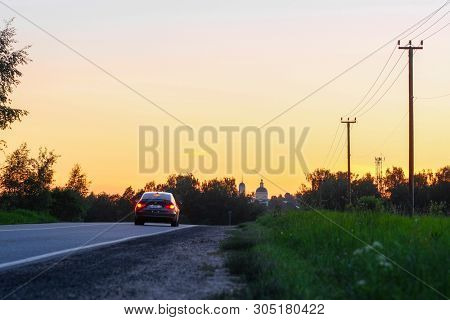 Moscow region, Russia - June, 2, 2019: image of Landscape with the Image of a Country Road at sunset