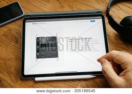 Paris, France - Jun 6, 2019: Man Reading On Apple Ipad Pro Tablet About Latest Announcement Of At De