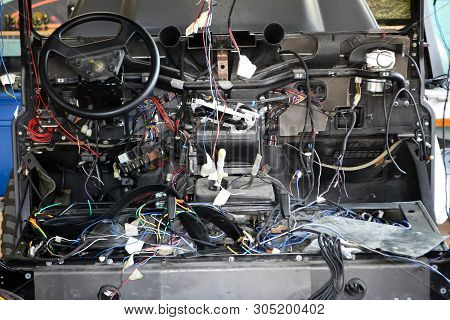 A Lot Of Ravel Multicolored Wires From The Car Wiring Lies In The Cabin Of Dismantled Car With Conne