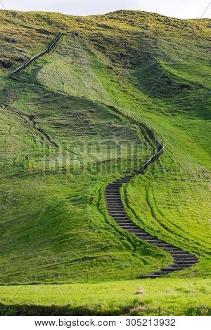 Small Path Leading Up A Green Hill