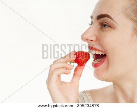 Beautiful Girl Makes Makeup Strawberry Berries On A White Background