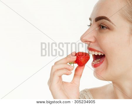 Beautiful Girl Makes Makeup Strawberry Berries On A White Background