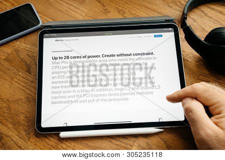 Paris, France - Jun 6, 2019: Man Reading On Apple Ipad Pro Tablet About Latest Announcement Of At De