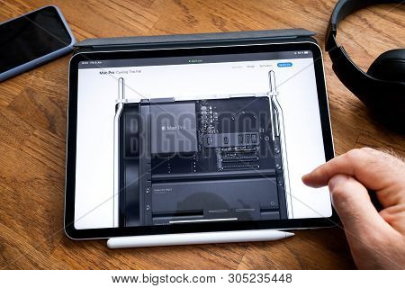 Paris, France - Jun 6, 2019: Man Reading On Apple Ipad Pro Tablet About Latest Announcement Of At De