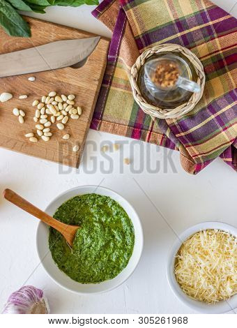 Pesto Sauce And Ingedients On A White Background. Italian Cuisine. Vegetarian Food. The Diet