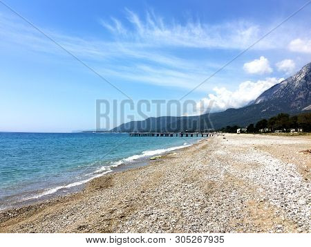 View Of Beldibi Beach In Turkey. Yellow Sand On The Beach