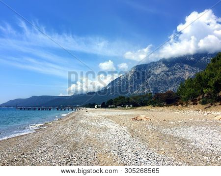 View Of Beldibi Beach In Turkey. Yellow Sand On The Beach