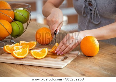 Cooking, Food And Concept Of Veganism, Vigor And Healthy Eating - Close Up Of Female Hand Cutting Or