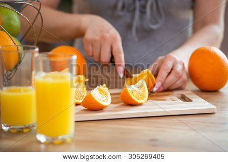 Cooking, Food And Concept Of Veganism, Vigor And Healthy Eating - Close Up Of Female Hand Cutting Or
