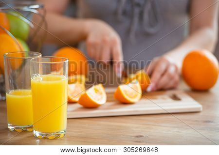 Cooking, Food And Concept Of Veganism, Vigor And Healthy Eating - Close Up Of Female Hand Cutting Or