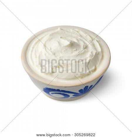 Bowl with fresh white cheese, called fromage blanc in France, used as a spread isolated on white background