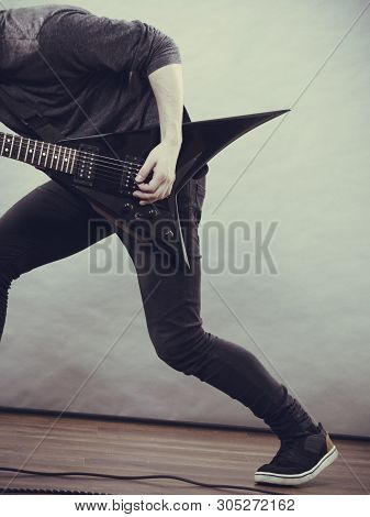 Man Playing On Electric Guitar During Gig. Musical Instrument. Teenage Boy Having Music Hobby.