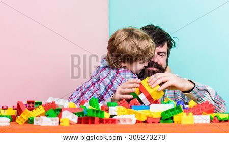 Father And Son Create Constructions. Bearded Man And Son Play Together. Surefire Ways To Bond With Y