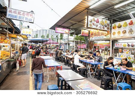Penang, June 7, 2019: People Dining At Gurney Drive Hawker Centre.  Gurney Drive Offers Variety Of P