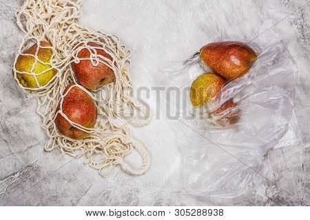 Fresh Pears In A Mesh Bag On Stone Background With Green Monstera Leaves. Zero Waste, Less Plastic C