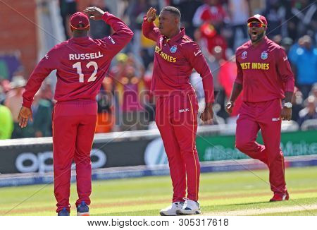 NOTTINGHAM, ENGLAND. 06 JUNE 2019: Sheldon Cottrell of West Indies celebrates taking the wicket of David Warner of Australia during the Australia against West Indies, ICC Cricket World Cup match
