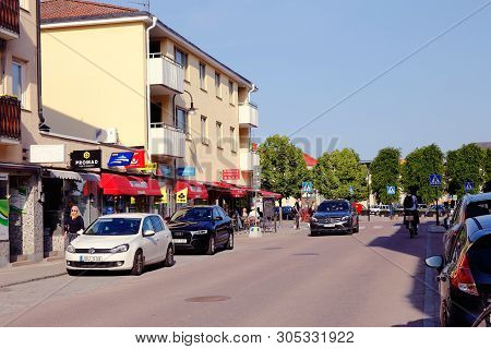 Strangnas, Sweden - June 5, 2019: View Of The Storgatan Street With Traffic In The City Center.